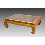 A large Oriental hardwood coffee table with inset Chinese carved window panel, modern, the window