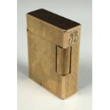 A vintage S T Dupont gold plated pocket lighter, number BY 3550, inscribed initials to lid end 'JB',