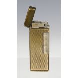 A cased 1960's gold plated Dunhill Rolagas lighter.