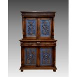 A French oak and painted two-part cabinet, late 19th / early 20th century, the flared, stepped