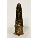 A Grand Tour style specimen marble obelisk, in the style of Cleopatra's Needle, 16¼in. (41.3cm.)
