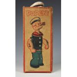 A celluloid windup clockwork Popeye with original box, 'King Features Synd. 1929', damage to