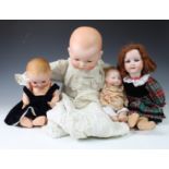 Four Armand Marseille bisque head dolls, the first - impressed 300n, DRGM 2467, with weighted blue