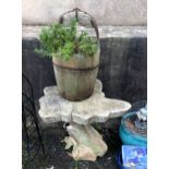 A naturalistic tree trunk / root garden table, 24in. (61cm.) high, 27in. (68.5cm.) at widest,