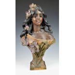 An Alphonse Mucha Art nouveau style plaster bust, of a young maiden with long flowing hair,