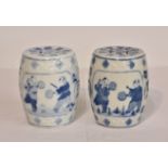 A pair of modern miniature Chinese barrel-shaped garden seats, blue & white, of typical form but