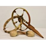 An antique painted push wheel toy, the wheel with wooden rim and metal spokes with attached coloured