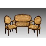 A French carved oak salon suite, in the Louis XV manner, early 20th century, comprising a two seater