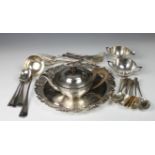 A silver plated salver or tray, of circular shaped form with cast grapevine and pierced raised