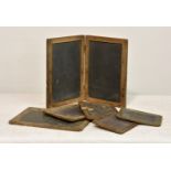 A small collection of vintage writing slates, one cased in folding wooden frame, together with