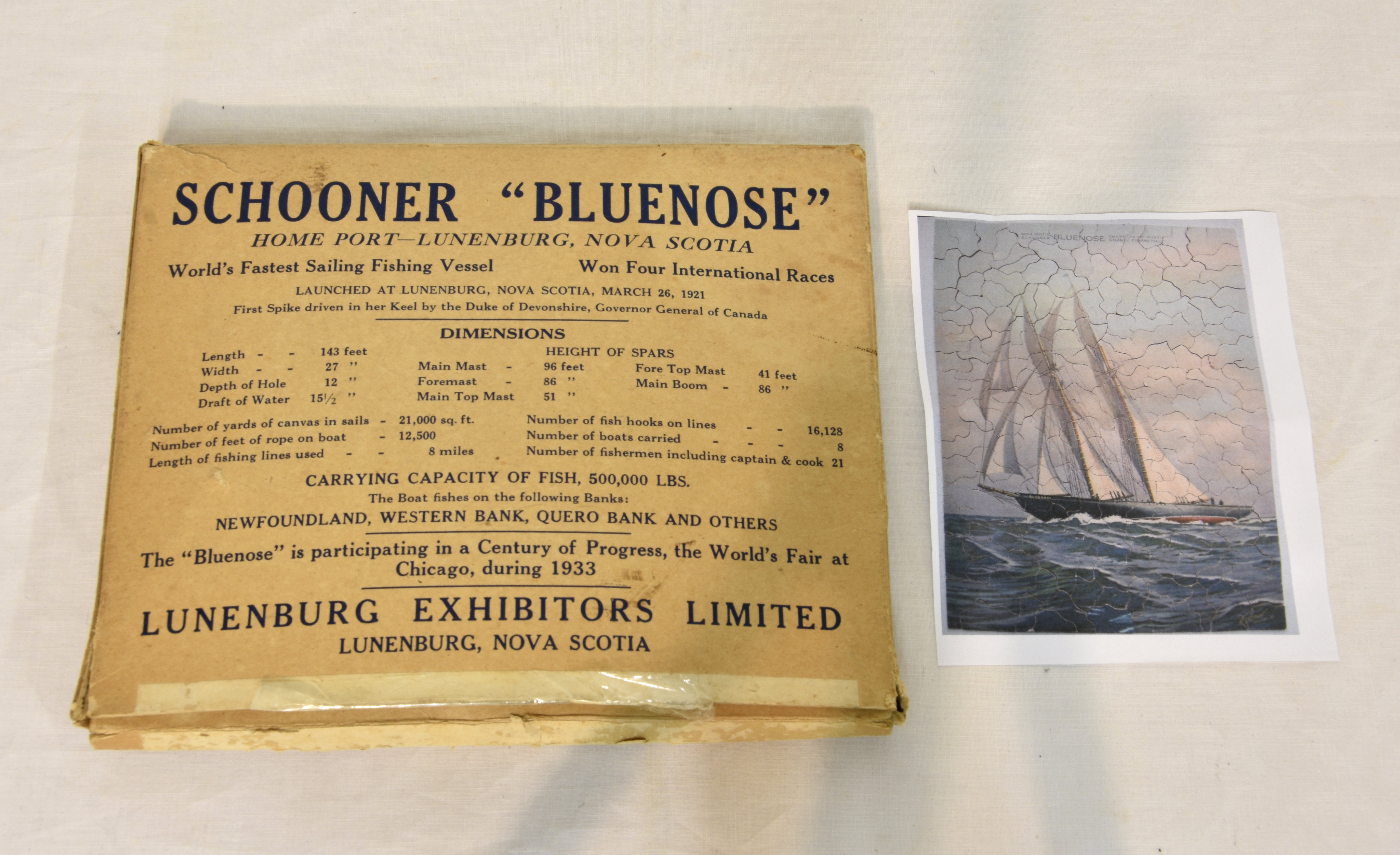 A rare boxed 1933 hand cut jigsaw puzzle - Schooner "Bluenose", Lunenburg Exhibitors Limited, Nova