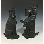 Two cast metal fire side / door stop dogs, 20th century, to include a Scottie dog on hind legs, REDG