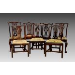 A harlequin set of seven George III and later mahogany dining chairs, comprising five George III