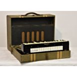 A Selmer Clavioline portable electric keyboard, in original case, amp & speaker combined in lid,