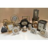 A collection of vintage and modern clocks, to include two carriage clocks and various others,