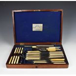 A mahogany cased bone handled carving set, by Joseph Rodgers & Sons, comprising of 24 knives in