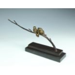 An Art Deco style bronze of three birds perched on a branch, second half 20th century, with mid-