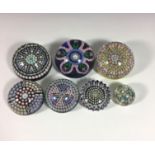 PERTHSHIRE - Five Millefiori glass paperweights, each having multi-coloured canes and clusters,