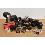 A collection of Canon and other cameras and accessories, comprising of Canon EOS 100; Canon EOS 5;