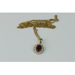 A 9ct gold, white and red stone pendant on a 9ct gold fancy-link chain.,