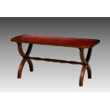 A Georgian style mahogany leather-top coffee table, the rectangular top with rounded angles,