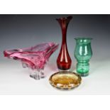 Four pieces of mid-century art glass, comprising of a Murano pink glass centrepiece bowl of