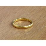 A 22ct yellow gold wedding band - inscribed to inner - weight 2.9g.,