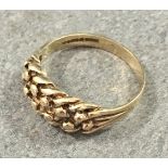 A 9ct yellow gold ring with pierced woven decoration, size L½.