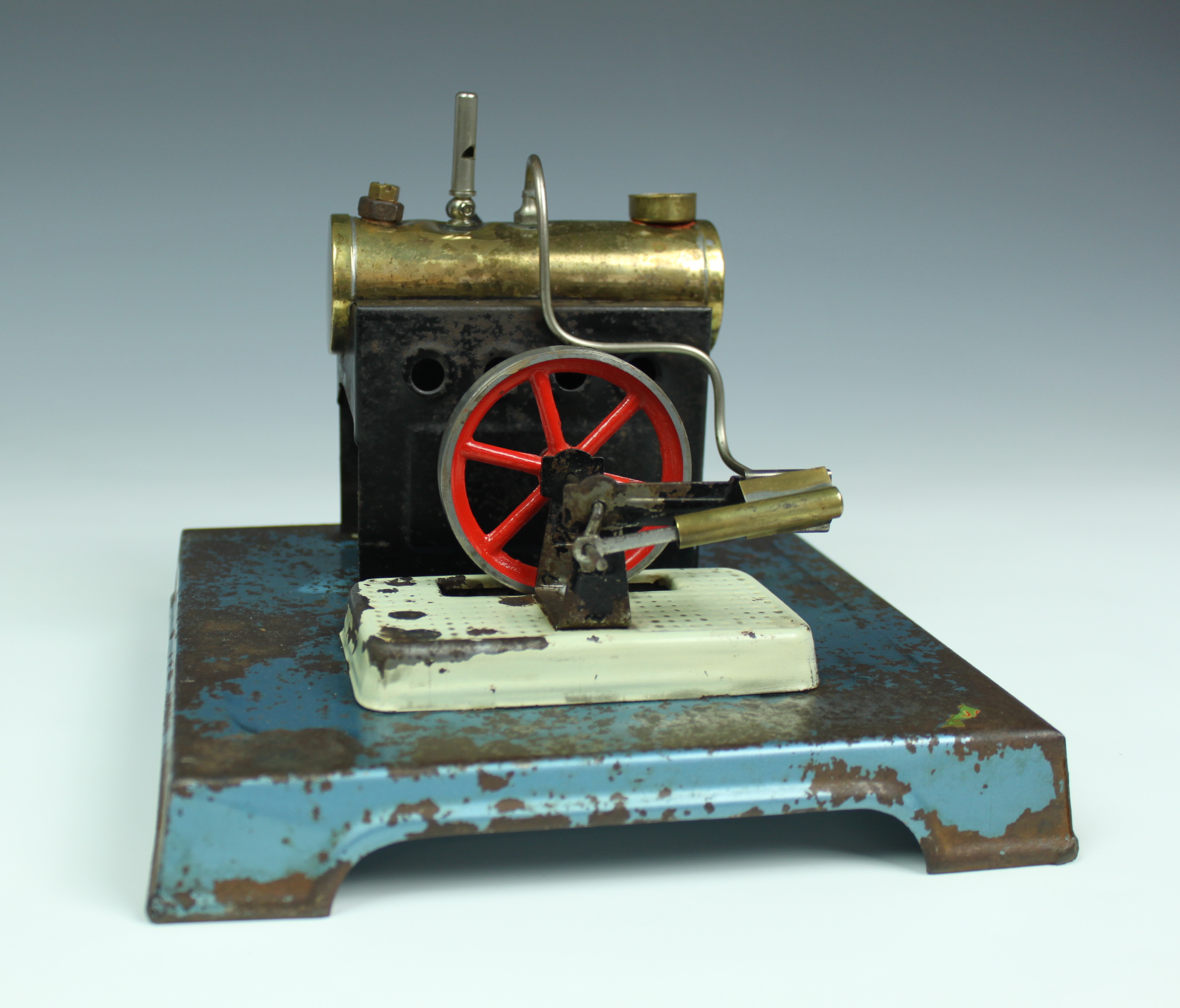 A vintage stationary live steam engine, with anvil, grinder & buffer accessories, unsigned, 8 x 8in.