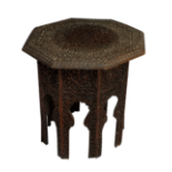 An ornately carved Anglo-Indian hardwood folding occasional table, early 20th century, with