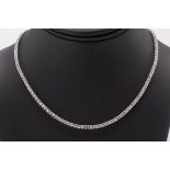 An 18ct white gold and diamond line necklace, featuring approximately 10.40ct of brilliant cut