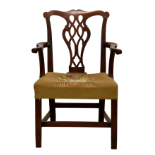 A George III mahogany country Chippendale elbow chair, the shaped yoke top rail over a pierced