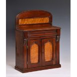 A Victorian mahogany miniature chiffonier, c.1860, arched back with open shelf, cushion moulded