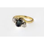 A vintage 18ct gold, sapphire and diamond ring, the central, oval cut sapphire measuring