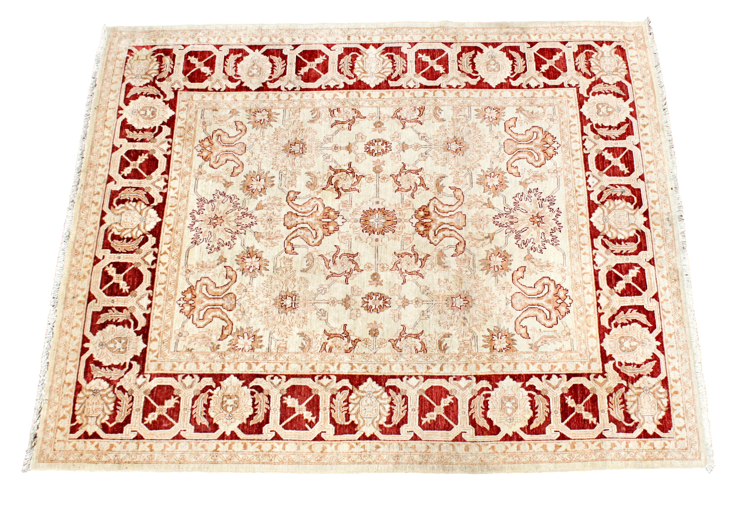 An Indian Zeigler rug, purchased from Harrods, the ivory field with all over floral and vine