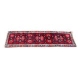 A Turkish Dosemealti wool runner, second half 20th century, the bright madder field with all over