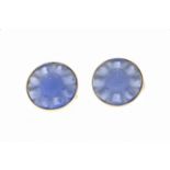 A pair of Lalique glass earclips, each ear clip formed of a pale blue glass flowerhead with seeds to