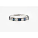 An 18ct white gold, diamond and sapphire half eternity band, featuring 4 single cut diamonds held in