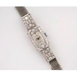 A mid-century 18ct white gold and diamond ladies cocktail watch, the silvered rectangular dial