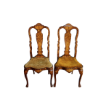A pair of 18th century Dutch walnut and marquetry chairs, the vase shaped splat decorated with a