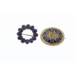 A Victorian yellow gold and amethyst target brooch, set with twelve oval cut amethysts, 24mm.