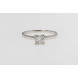 An 18ct white gold and diamond single stone ring, with a 0.60ct princess cut diamond, ring size K.
