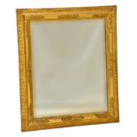 A late 19th-early 20th century gilt and composition mirror, the rectangular plate within a