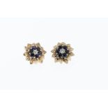 A pair of 9ct gold, sapphire and diamond flower earrings, each earring featuring a round cut