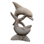 A grey granite garden dolphin sculpture, depicting two dolphins breaching, 28in. (71cm.) high. * One