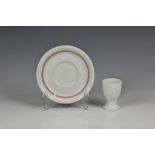 A Kriegsmarine Officer's china mess saucer and egg cup, both stamped to base and dated 1940, the