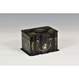 A Victorian papier-mache tea caddy, c.1860, of rectangular form with serpentine front, inlaid with