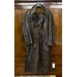A German Army brown leather great coat, light brown suede lining with original label '
