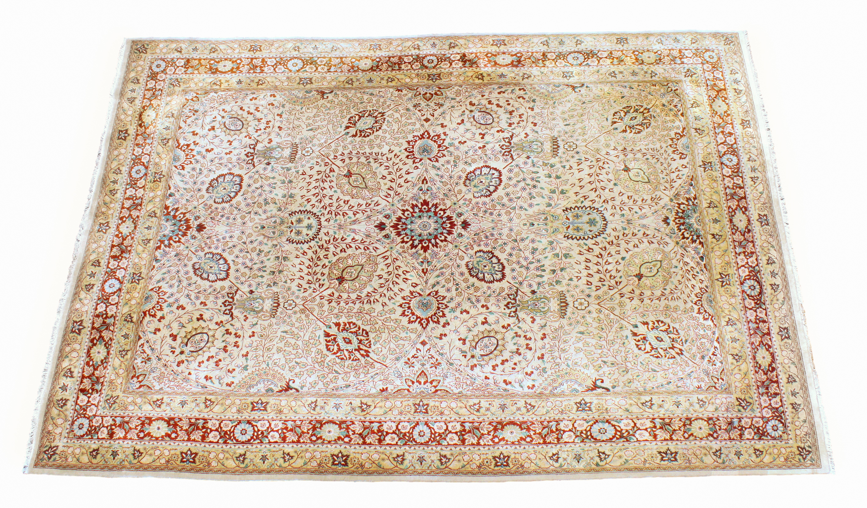 A Qum style rug, purchased from Harrods, late 20th century, the pale buff field with central