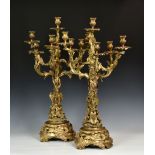 An impressive pair of French rococo style gilt bronze six light candelabra, late 20th century, of